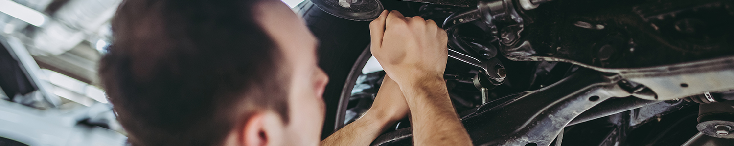 Mechanic doing some repairs on a vehicle - Car Repairs Chertsey